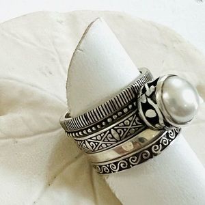 Janice Girardi sterling, silver pearl Stack rings.